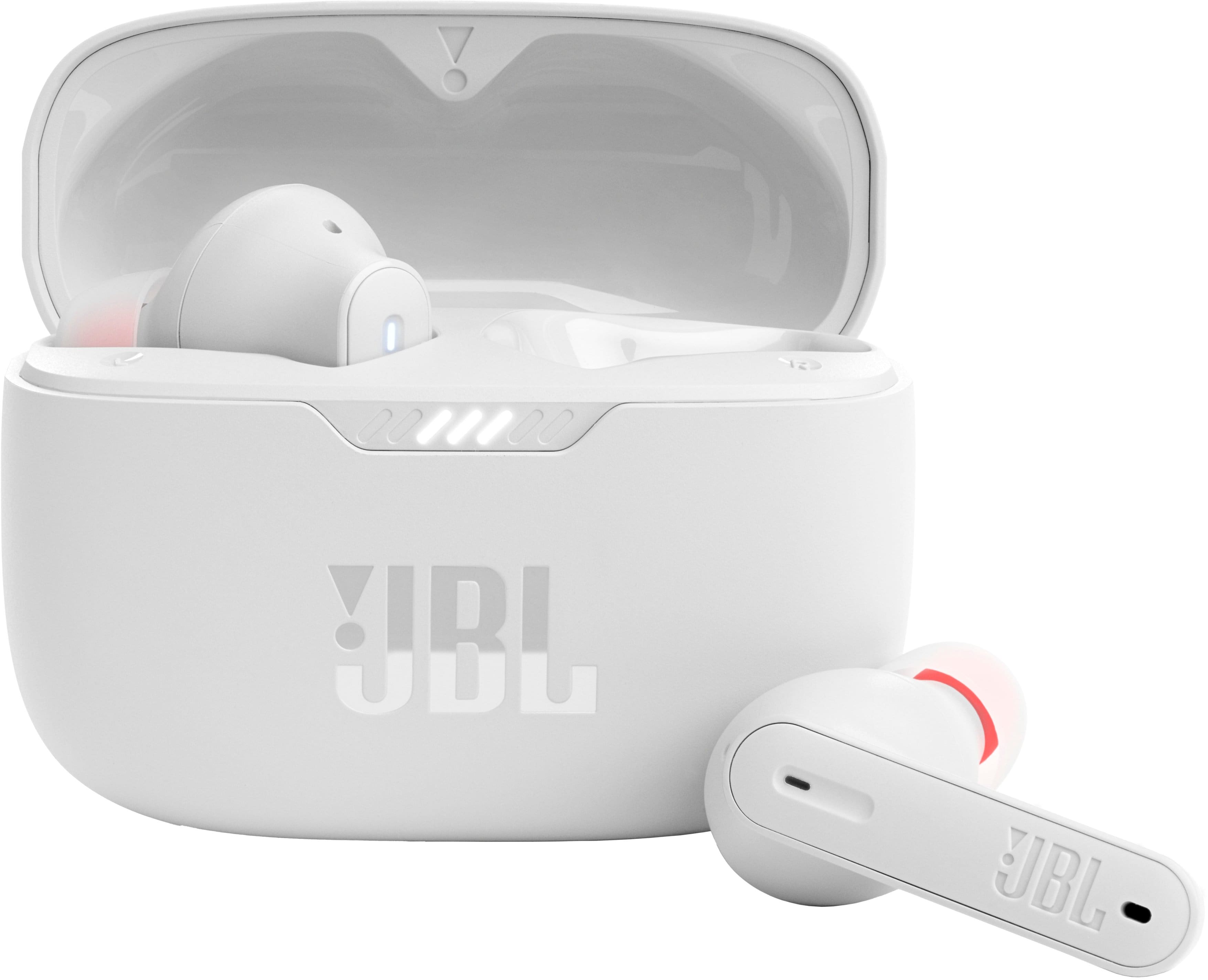 JBL Tune 230NC earbuds in real‑life use, white earbuds in a commuter's hand