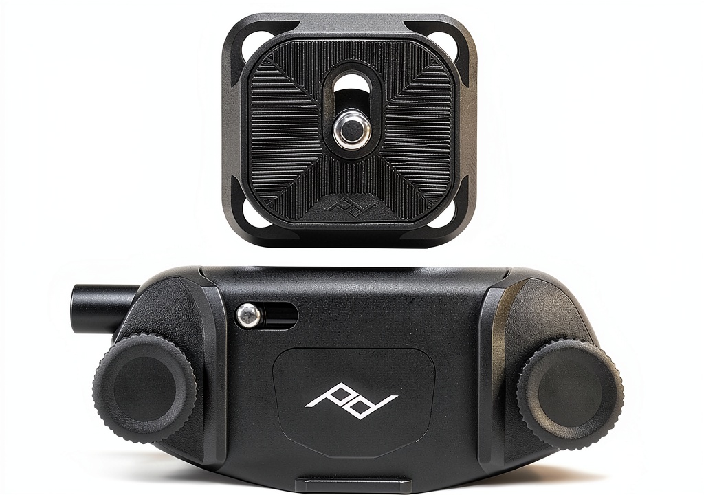 Peak Design Capture Clip mounted on backpack strap during hiking